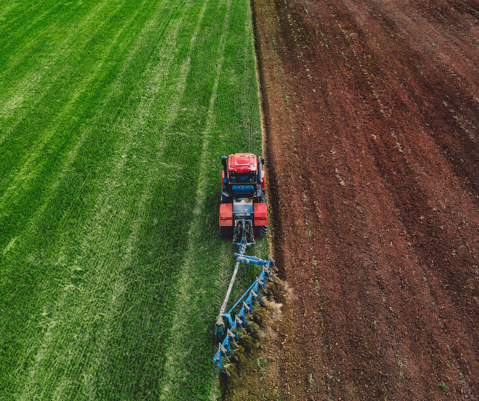 Tractor plowing field