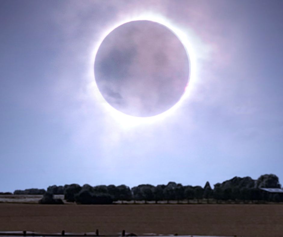 a solar eclipse over a rural area