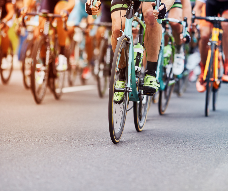 group of cyclists on a paved road