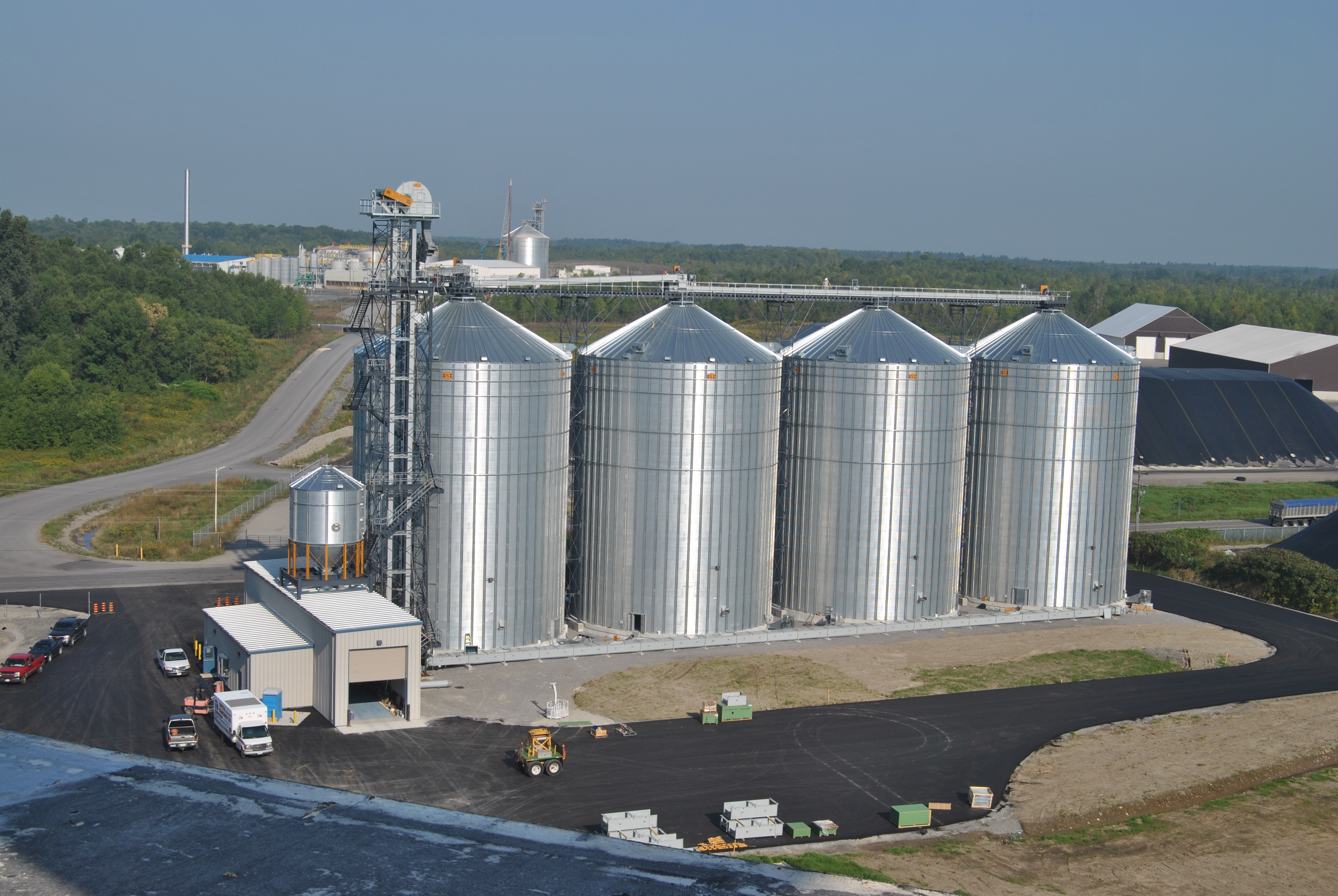 Four silos located in an industrial area