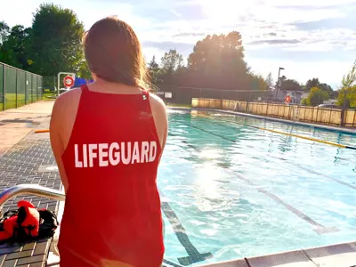 Lifeguard looking out over a pool