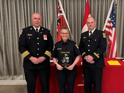 Chief Brian Moore with Ann Shorey, who was presented with a certificate for achieving Fire Officer Level One certification, Caption Steve Roberts and Scott Hayes from the Ontario Fire Marshal’s Office.