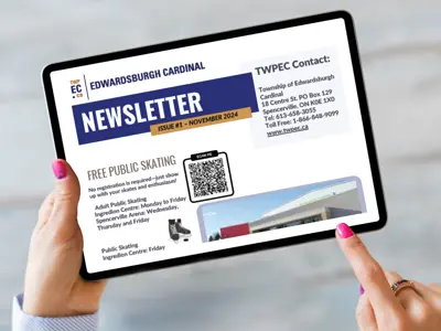tablet device held by hands displaying newsletter