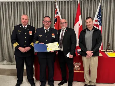 Fire Chief Brian Moore with Dan Davy, who was acknowledged for 30-years of service to the department, Mayor Tory Deschamps and Councillor Joe Martelle