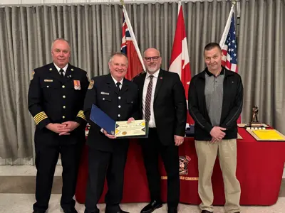 Chief Brian Moore, with Tim Nason, who acknowledged for 5-years of service, by Mayor Tory Deschamps and Councillor Joe Martelle.