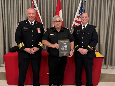 Fire Chief Brian Moore, with John Dobbie, who received the Response Award for attending the most calls in 2024, and Captain Steve Roberts.