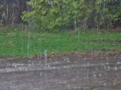 Heavy rainfall on a paved road