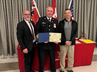 Mayor Tory Deschamps, with Chief Brian Moore who was acknowledged for 30 years of service to the department, and Councillor Joe Martelle.
