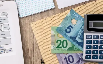 A computer, calculator and cash