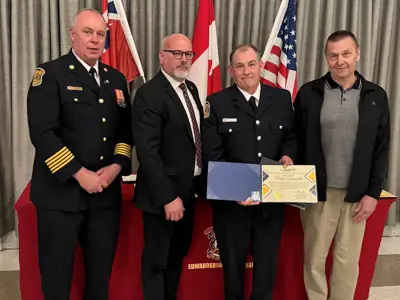 Fire Chief Brian Moore, Mayor Tory Deschamps with Pete Rainville, who was acknowledged for 5-years of service to the department, and Councillor Joe Martelle.