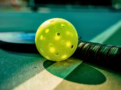 ball and rackets sitting on the court