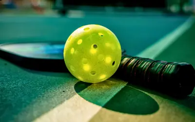 ball and rackets sitting on the court